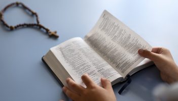 high-angle-kid-holding-bible